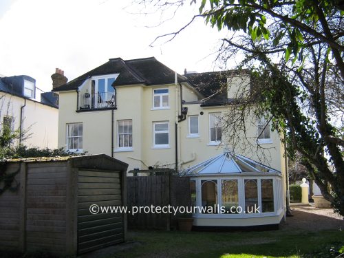 A freshly rendered cream house.