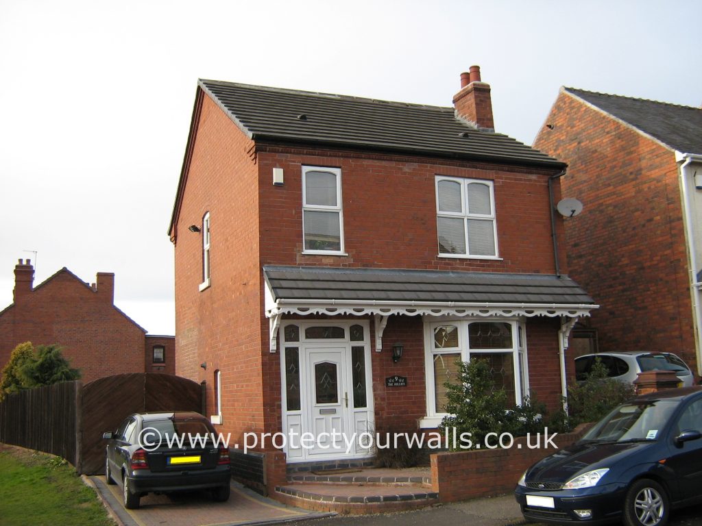 A brick house, front view.