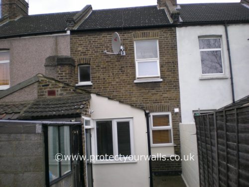 House in need of rendering, Bedfordshire - rear view.