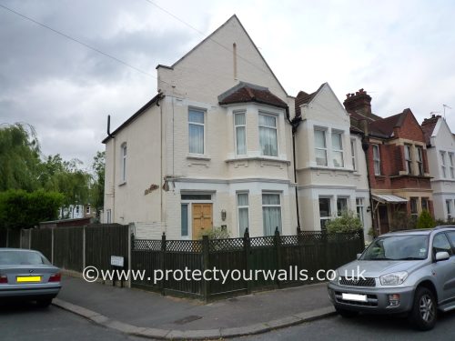 Cracked rendering on a house.