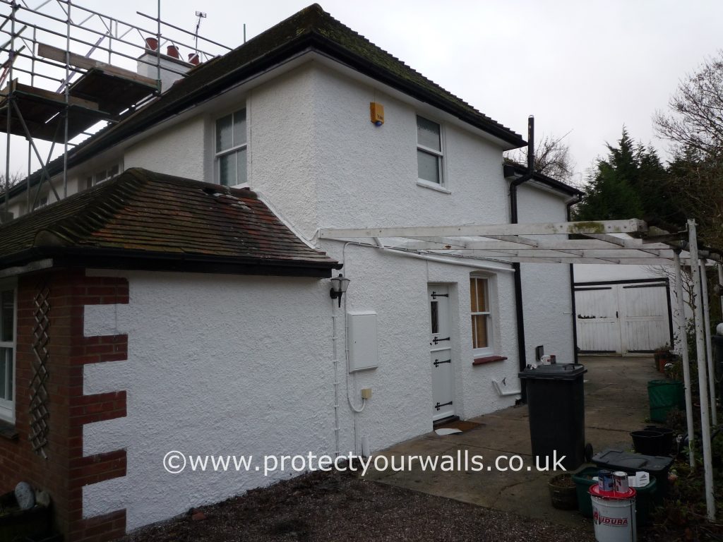 The process of rendering a cottage.