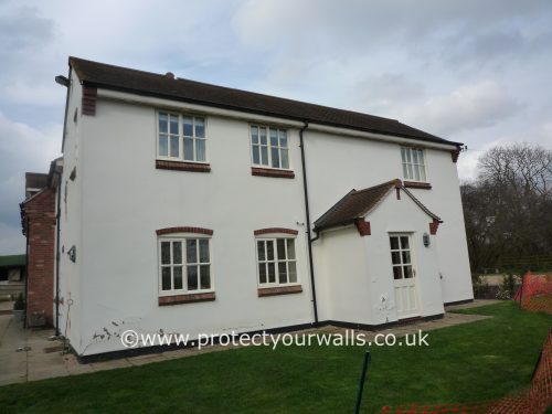 A house in need of new rendering.