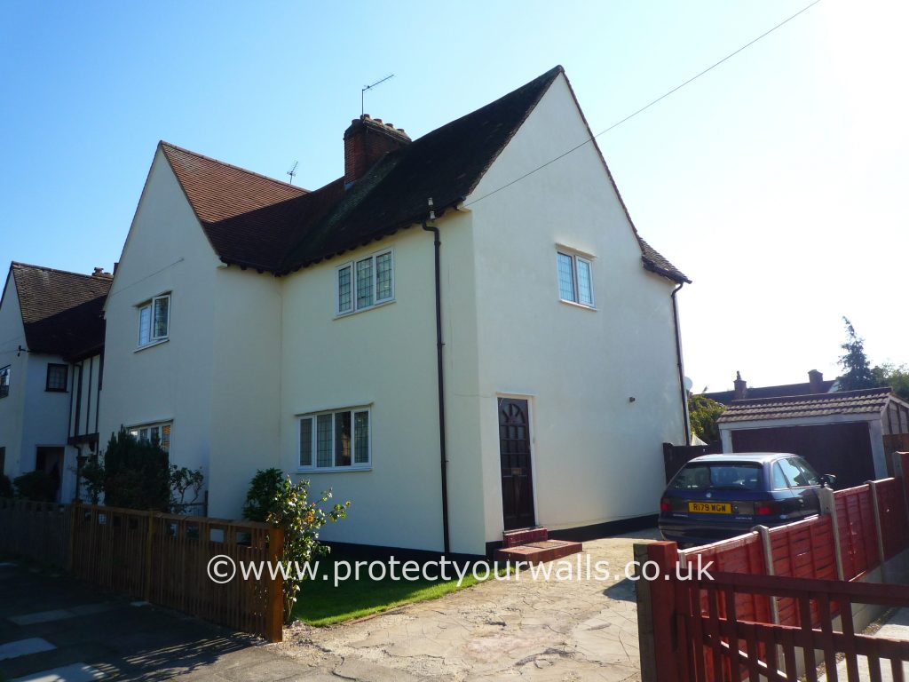 A newly rendered house in the sunshine.