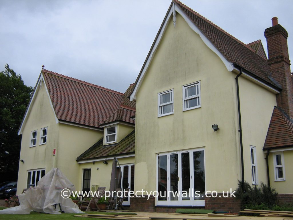 House in need of rendering, Essex - rear view.